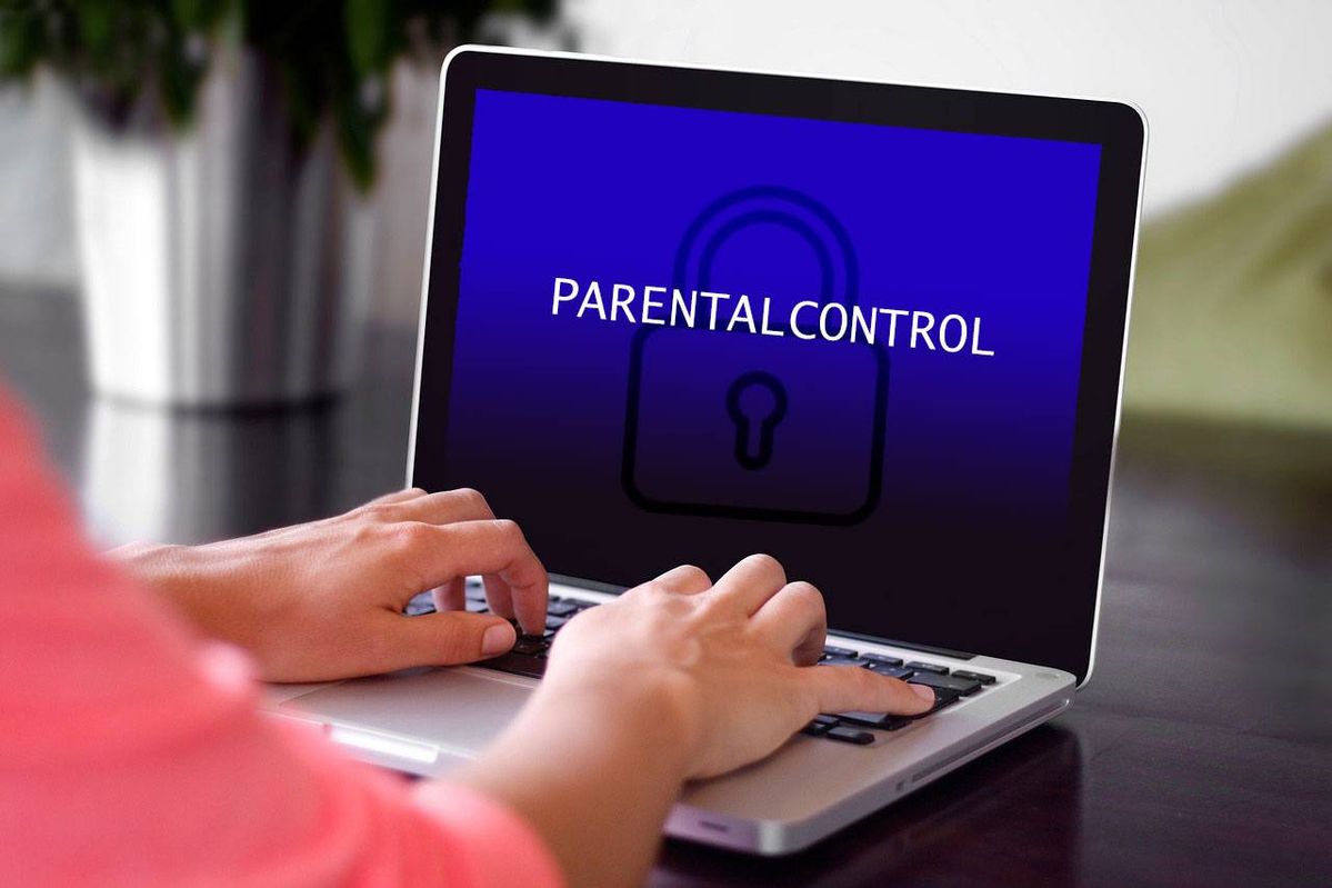 A parent configuring safer content settings on a child's phone